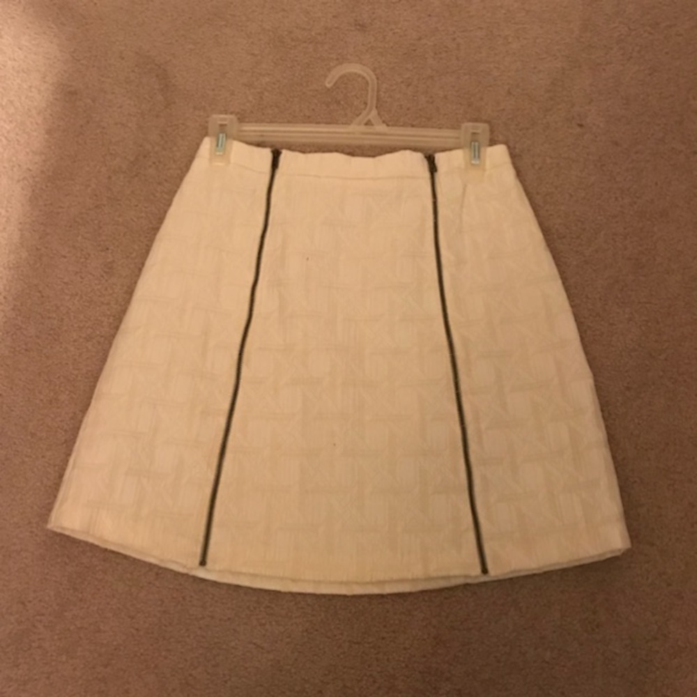 A cream mini skirt